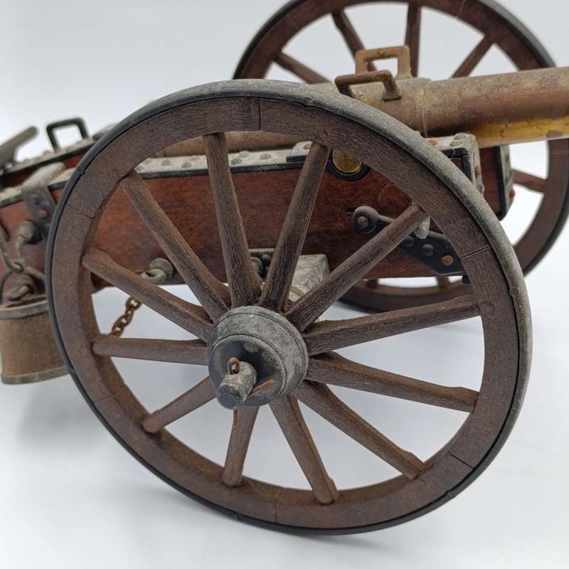 Vintage Napoleon toy cannon model with accessories