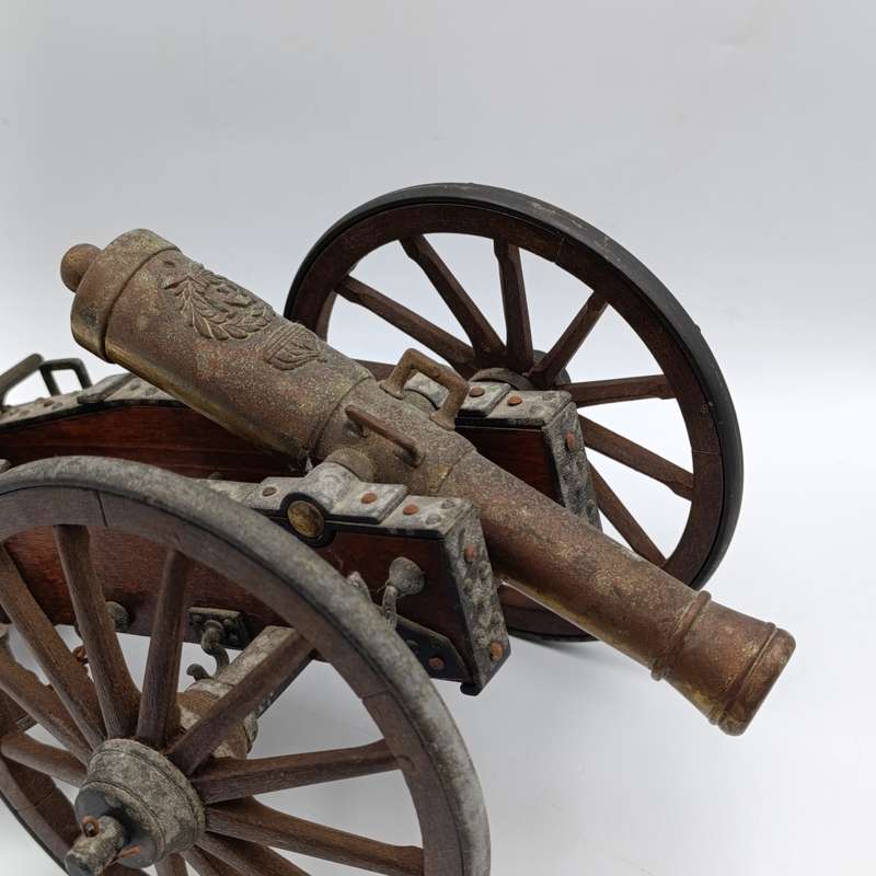 Vintage Napoleon toy cannon model with accessories