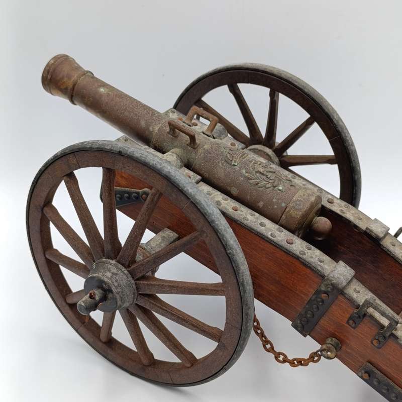 Vintage Napoleon toy cannon model with accessories