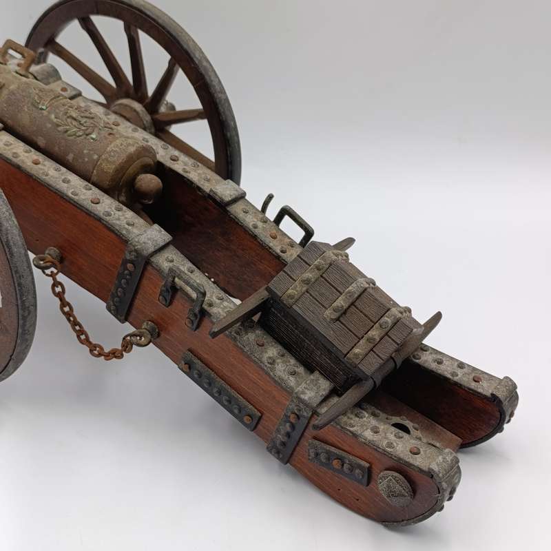 Vintage Napoleon toy cannon model with accessories