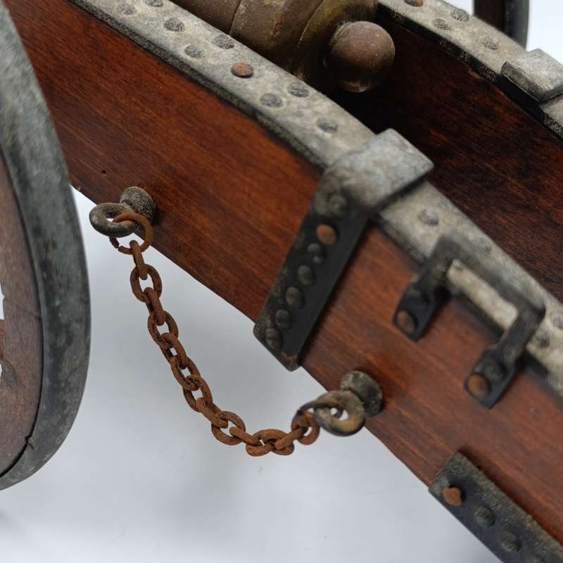 Vintage Napoleon toy cannon model with accessories