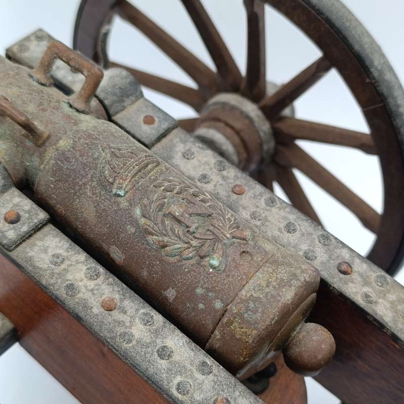 Vintage Napoleon toy cannon model with accessories