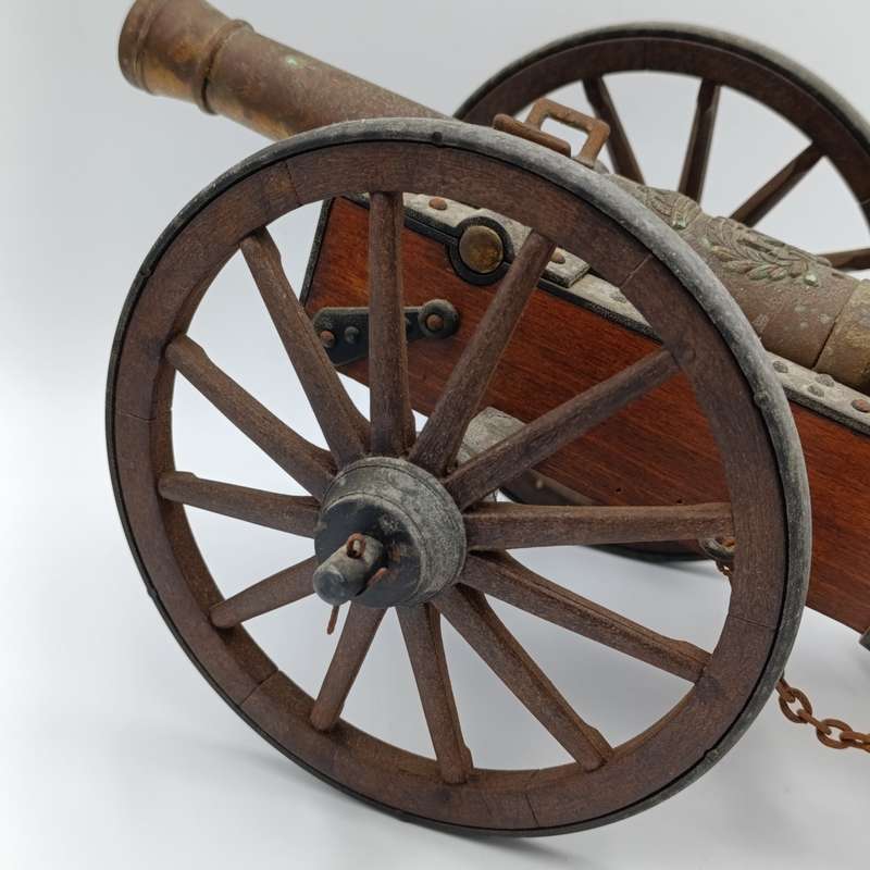 Vintage Napoleon toy cannon model with accessories