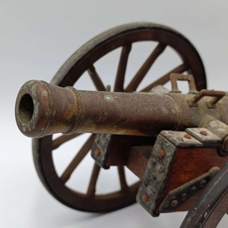 Vintage Napoleon toy cannon model with accessories