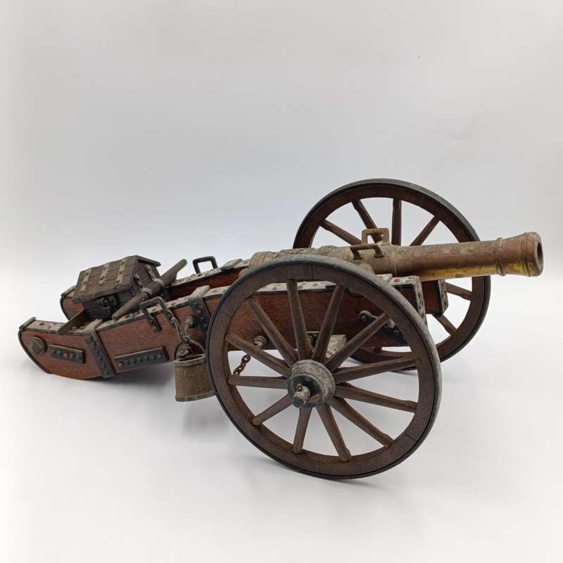 Vintage Napoleon toy cannon model with accessories