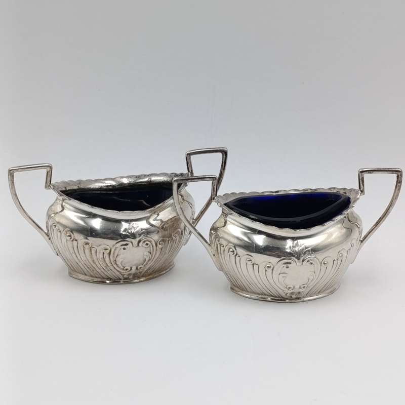 Pair of antique silverplated salt cellars with glass inners