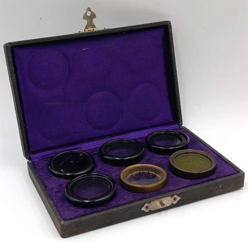 Antique camera lens filter set in case