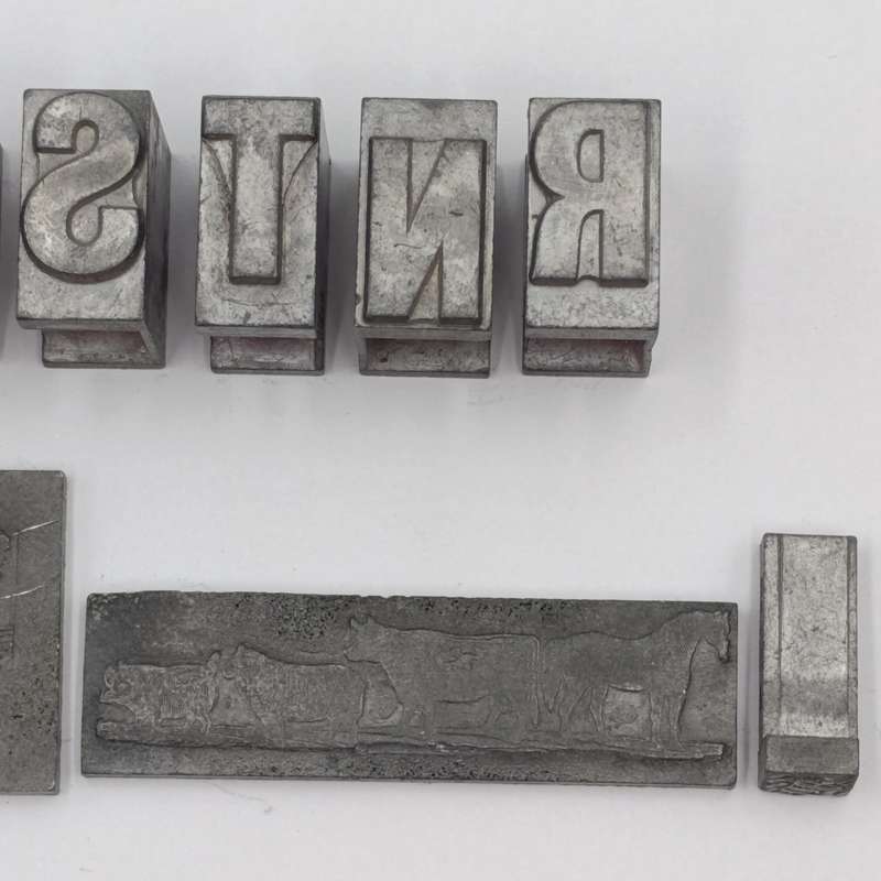 Lot of 13 metal letter and shape press block