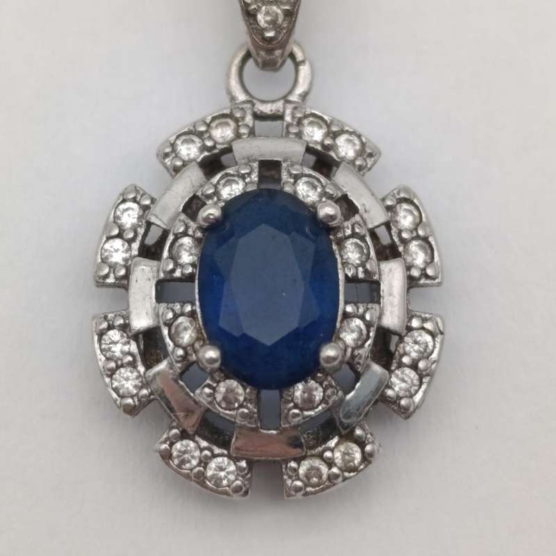 Sterling silver pendant with blue and clear stones - weighs 1.7g
