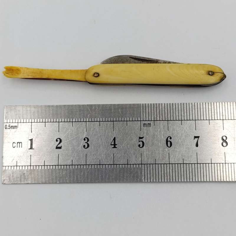 Antique small pocket knife with snuff spoon and picks