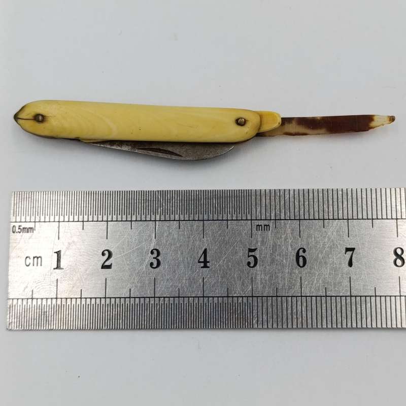 Antique small pocket knife with snuff spoon and picks