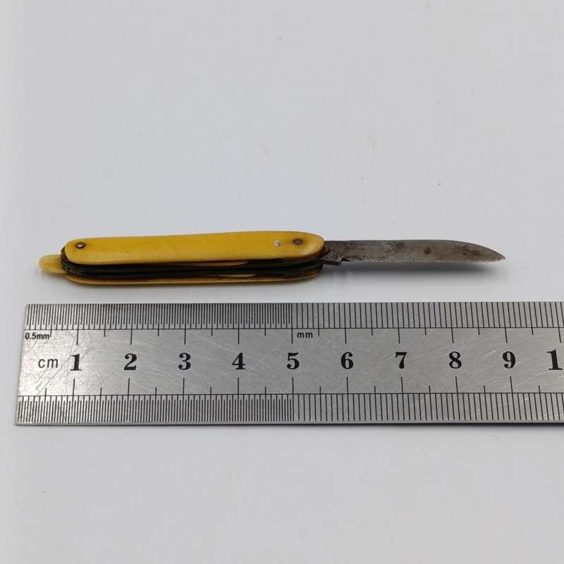 Antique small pocket knife with snuff spoon and picks