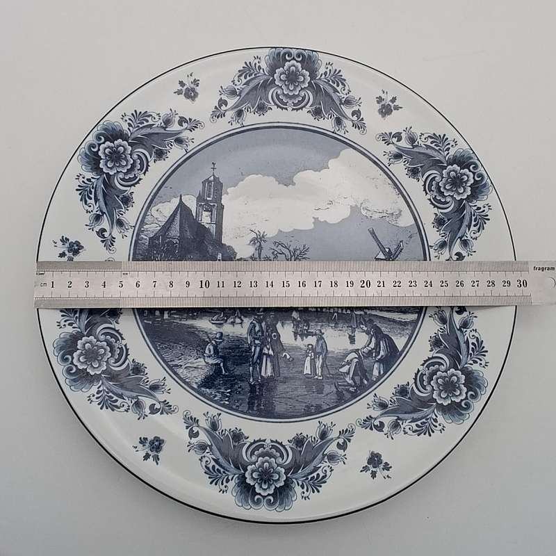 Vintage Delft Sunday winter scene on the frozen Delft canal porcelain plate