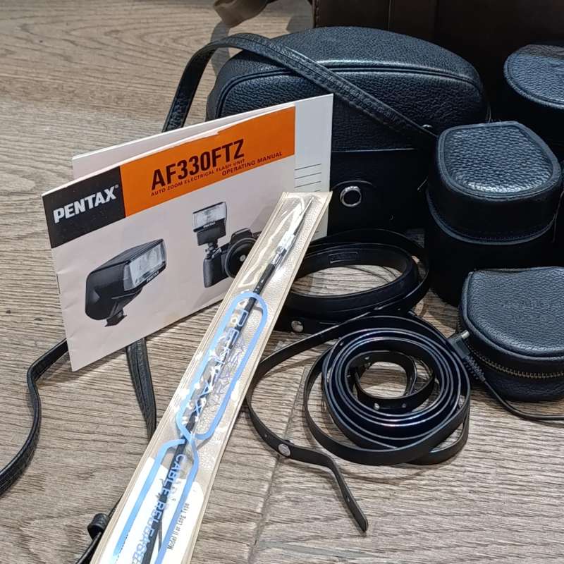 Vintage Pentax Spotmatic 35mm film camera with extra lenses and accessories in camera case