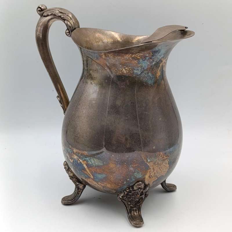 Antique silverplated pitcher with ice stopper