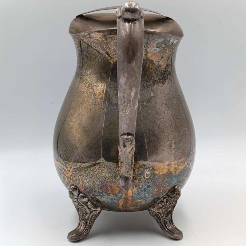 Antique silverplated pitcher with ice stopper