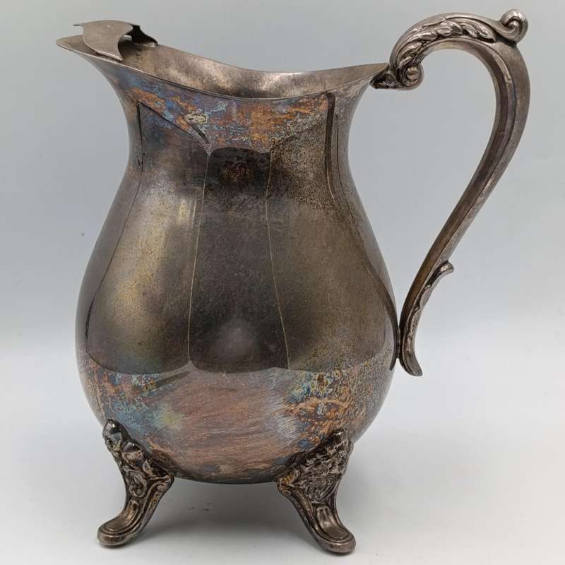 Antique silverplated pitcher with ice stopper