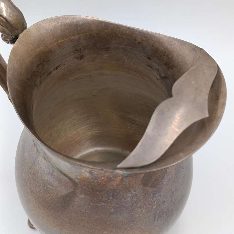 Antique silverplated pitcher with ice stopper