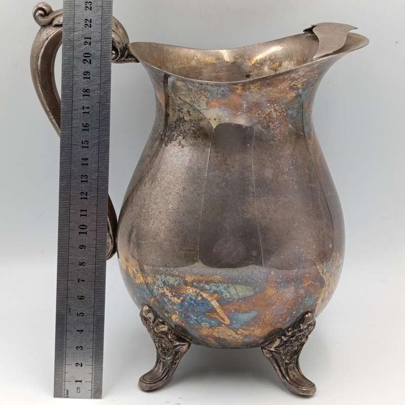 Antique silverplated pitcher with ice stopper