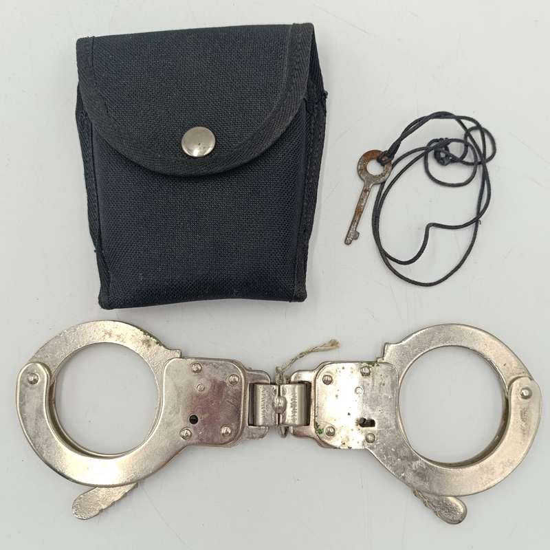 Pair of handcuffs in pouch