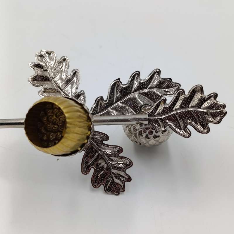 Acorn shaped candle snuffer