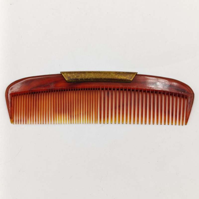 Antique pocket comb with brass case