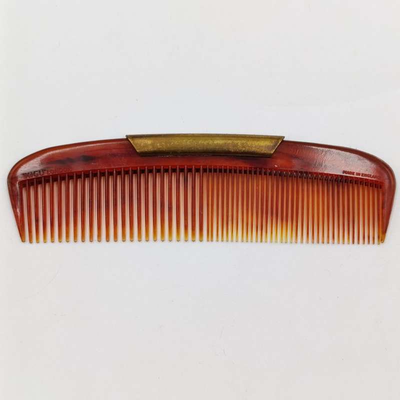 Antique pocket comb with brass case