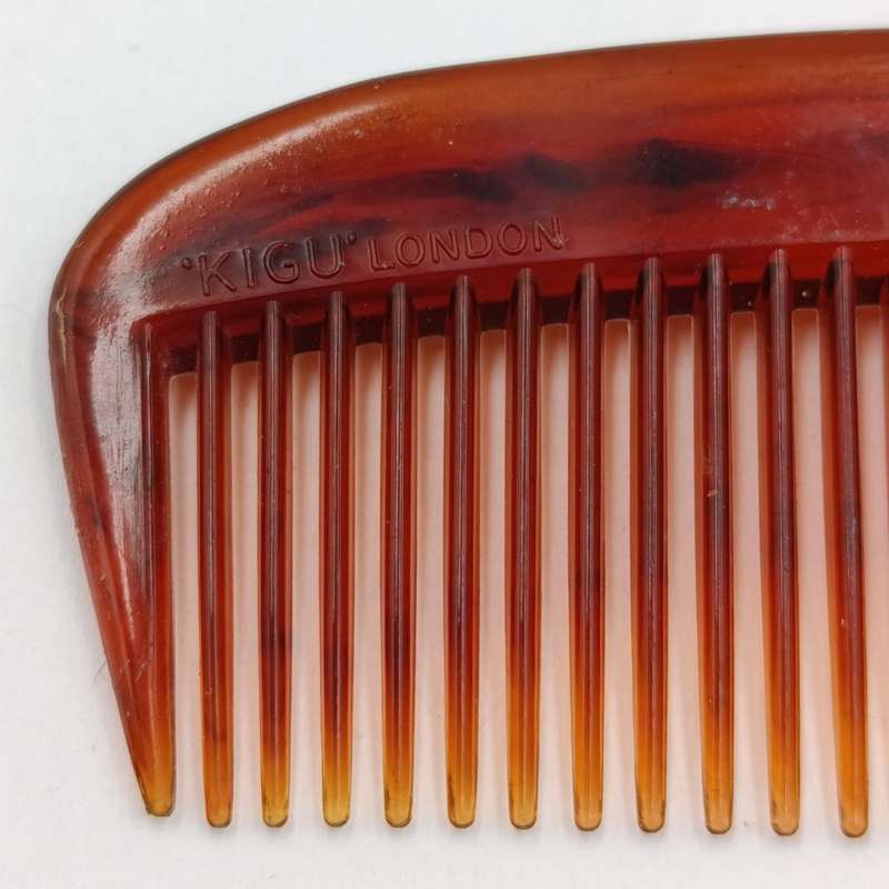 Antique pocket comb with brass case