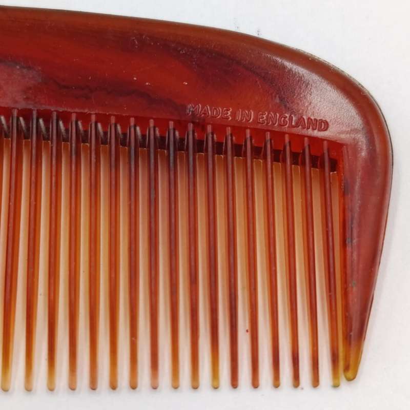 Antique pocket comb with brass case