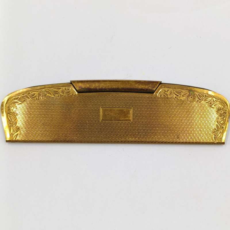 Antique pocket comb with brass case