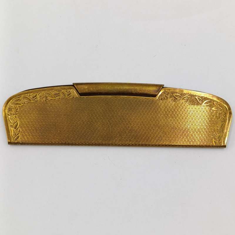 Antique pocket comb with brass case