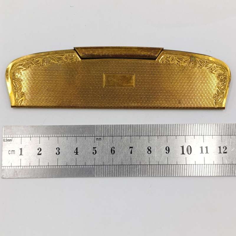 Antique pocket comb with brass case