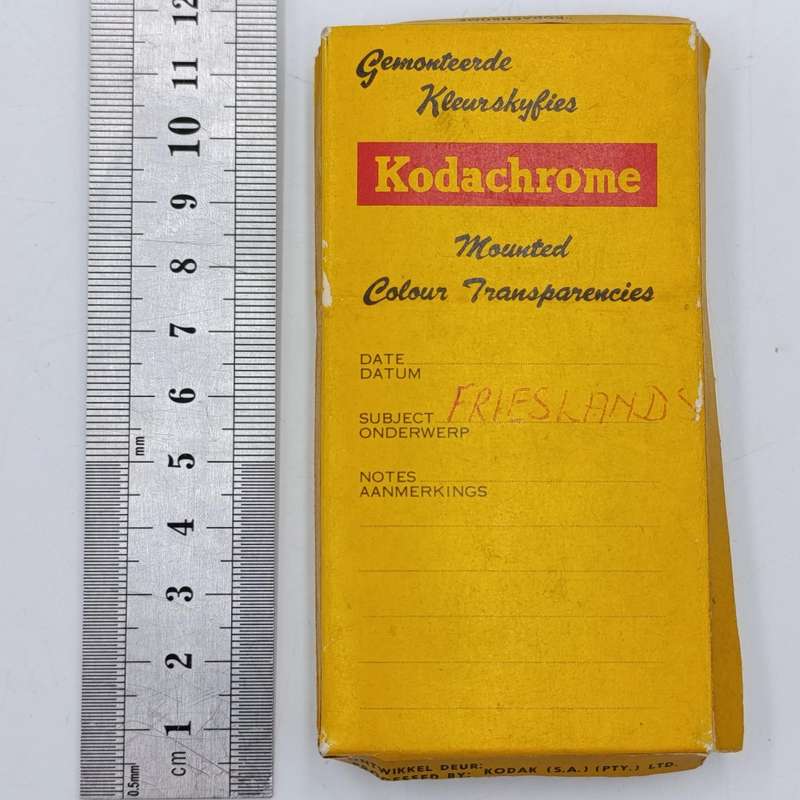 Vintage 8mm film reel and photo slides of Friesland cattle on Sir de Villiers Graaf farm