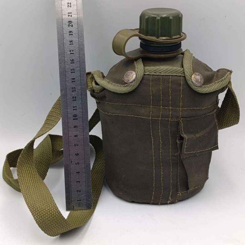 SADF water bottle with lid and firebucket in green material pouch and sling
