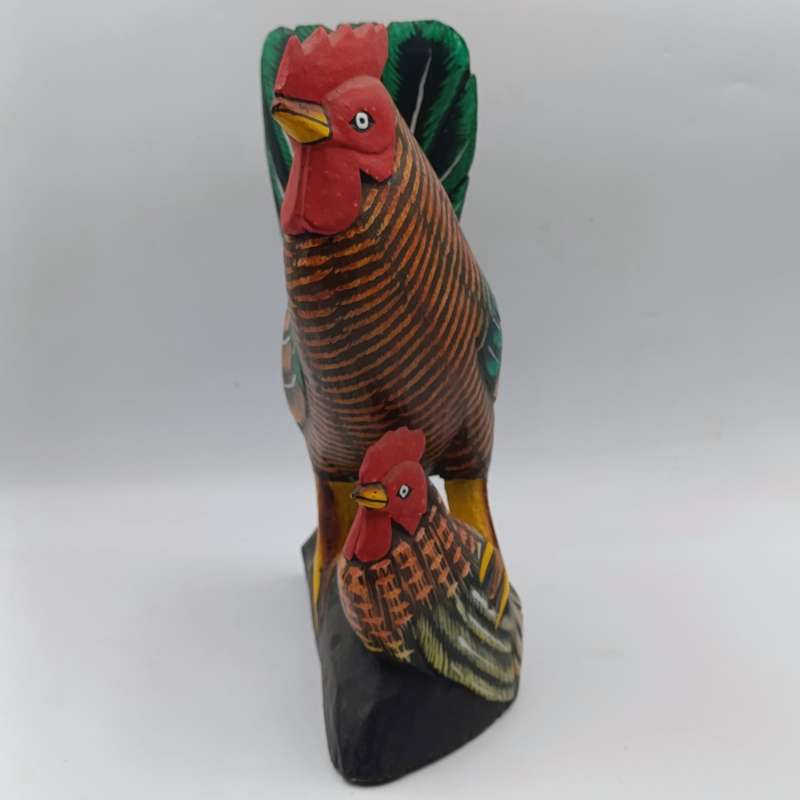 Beautiful wooden carved rooster with chick