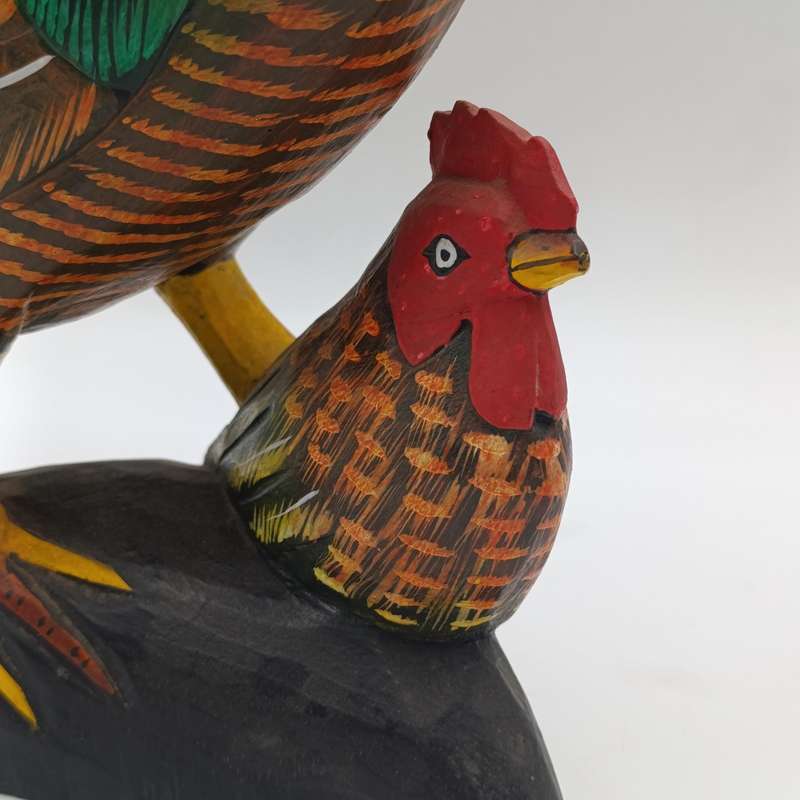 Beautiful wooden carved rooster with chick