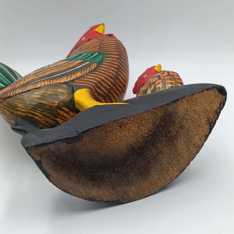 Beautiful wooden carved rooster with chick