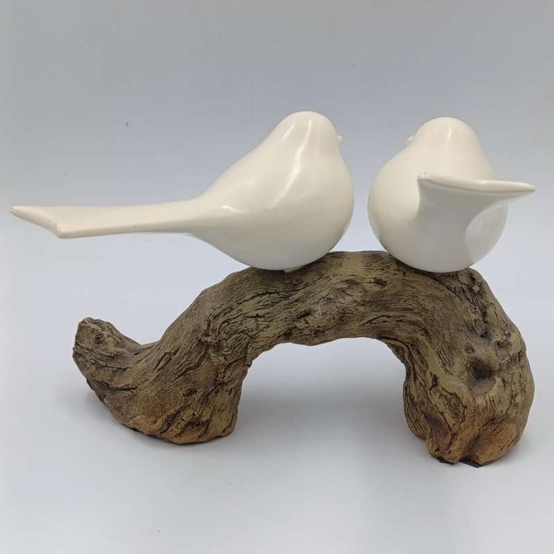Beautiful birds on log figurine - polyresin