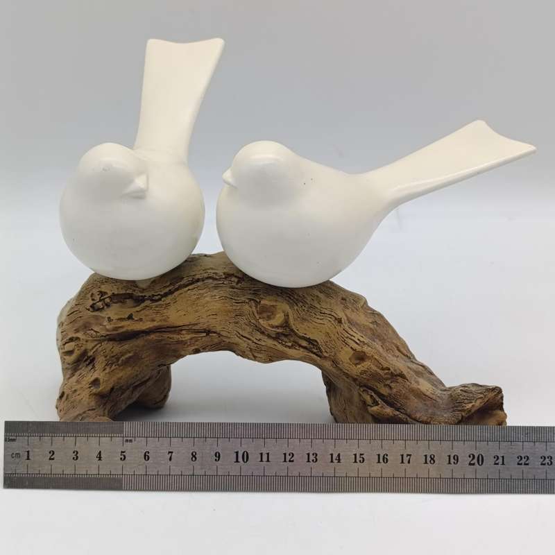 Beautiful birds on log figurine - polyresin