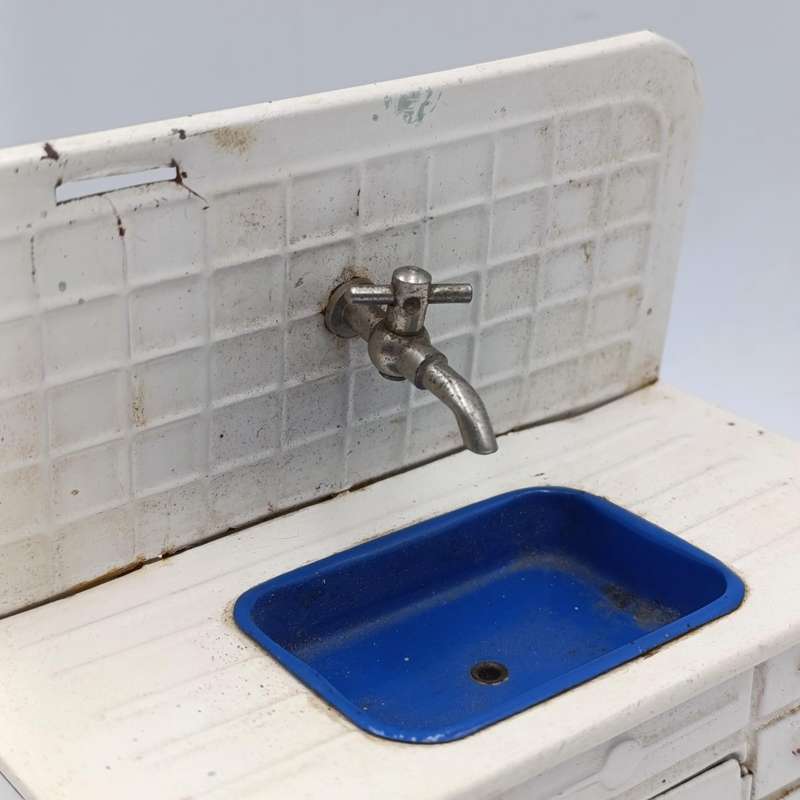 Vintage tinplate doll house kitchen sink with cupboard
