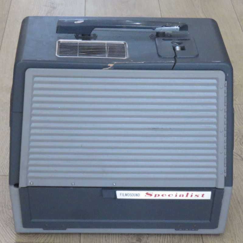 Bell and Howell Filmosound Specialist 16mm projector - working - some case damage