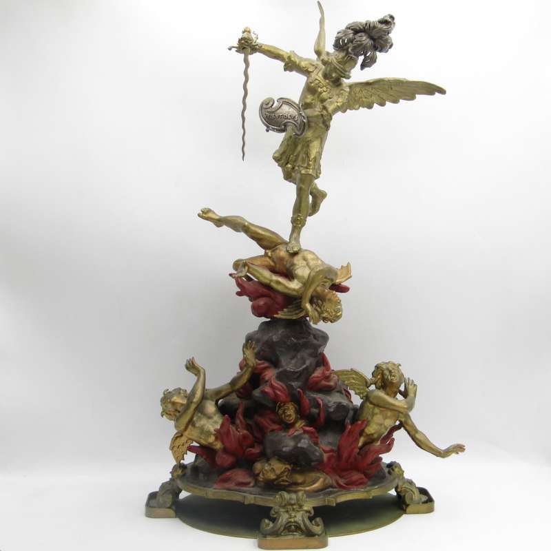 Vintage Large bronze statue of Archangel Michael casting the devil and demons into hell.