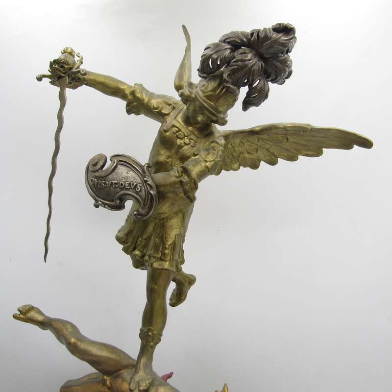 Vintage Large bronze statue of Archangel Michael casting the devil and demons into hell.