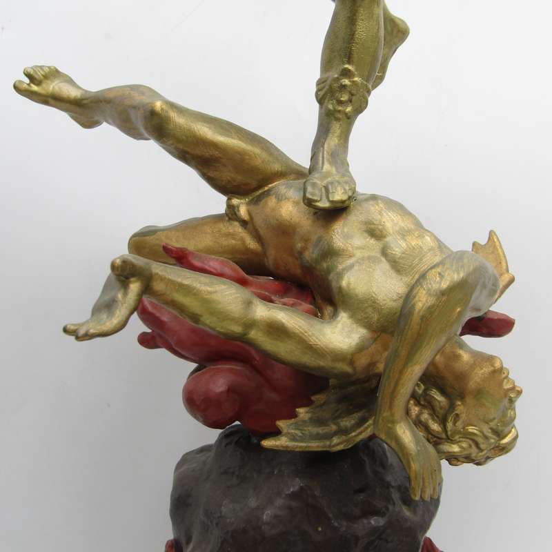 Vintage Large bronze statue of Archangel Michael casting the devil and demons into hell.