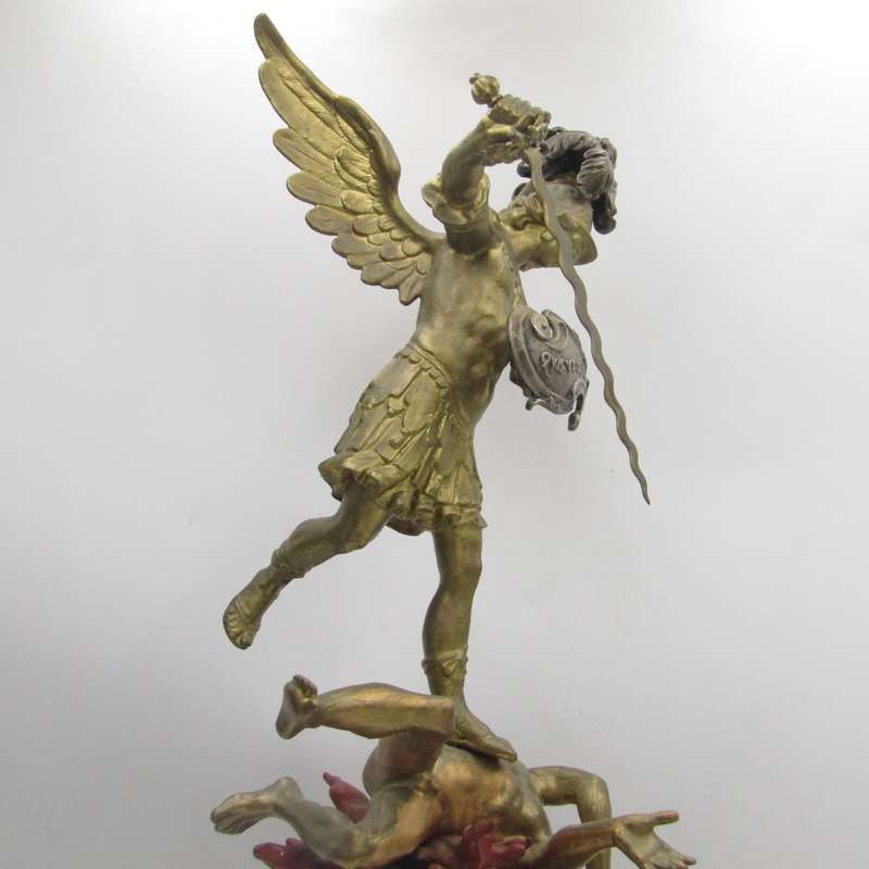 Vintage Large bronze statue of Archangel Michael casting the devil and demons into hell.
