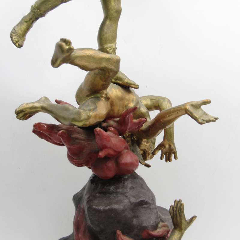 Vintage Large bronze statue of Archangel Michael casting the devil and demons into hell.