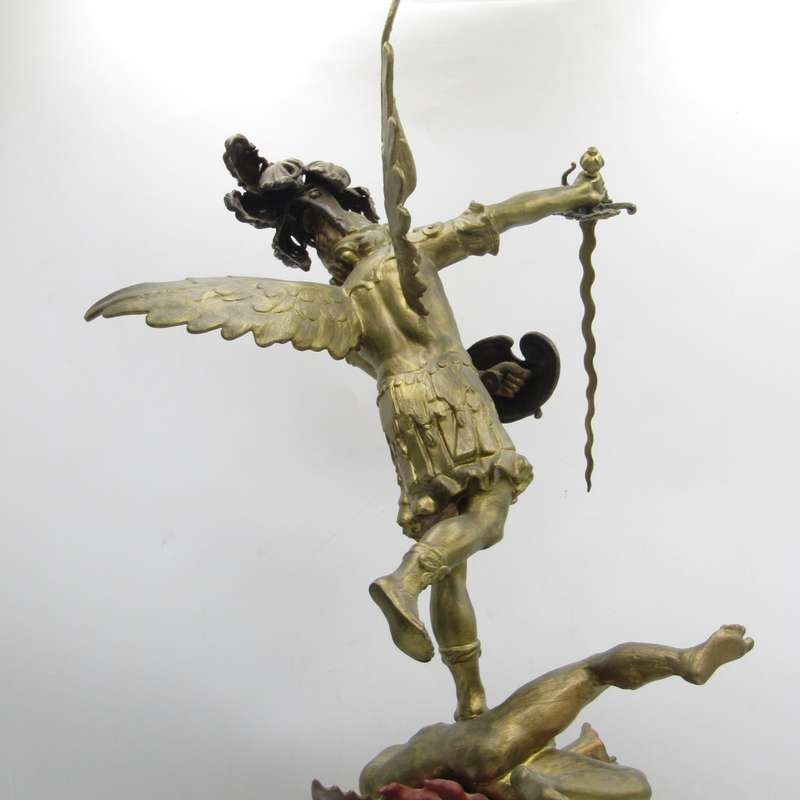 Vintage Large bronze statue of Archangel Michael casting the devil and demons into hell.