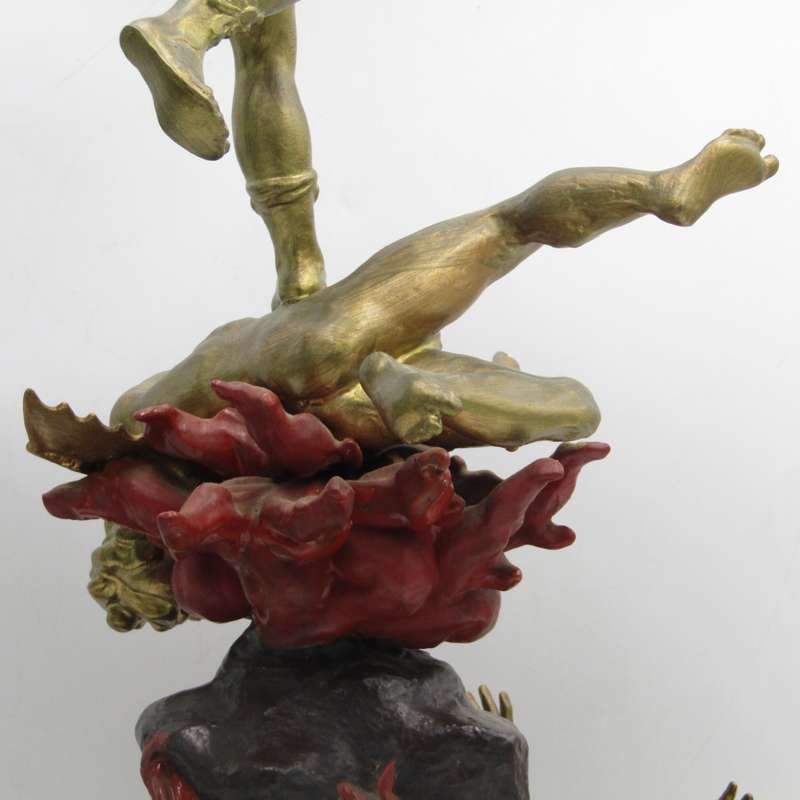Vintage Large bronze statue of Archangel Michael casting the devil and demons into hell.