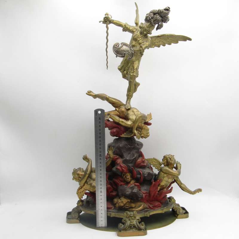 Vintage Large bronze statue of Archangel Michael casting the devil and demons into hell.