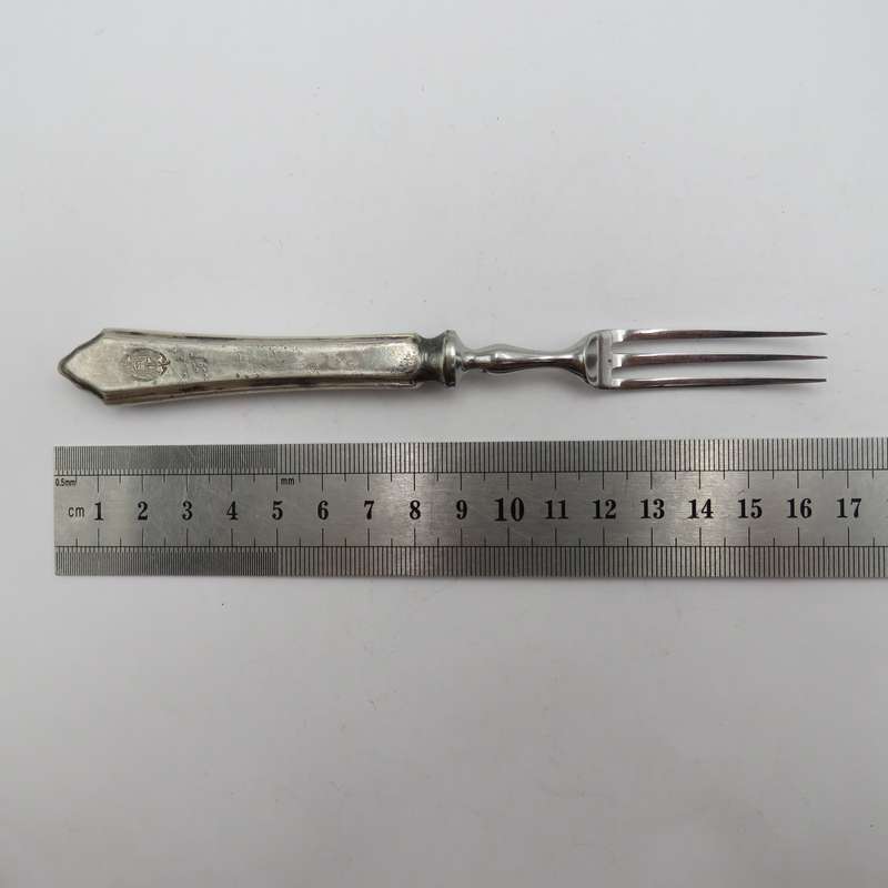 Antique pickle fork with ZAR Transvaal coat of arms on handle.